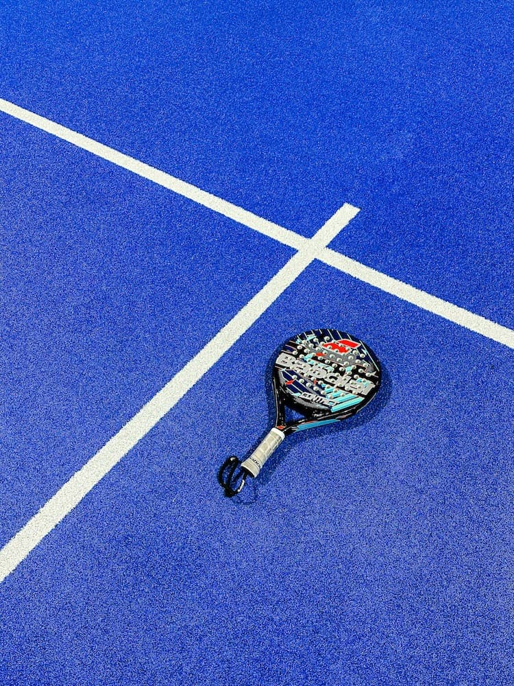 a padel racket and a ball